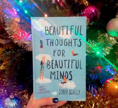 Beautiful Thoughts for Beautiful Minds beside a Christmas tree