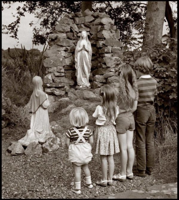 Children stand at a holy shrine, Co Waterford. 1984